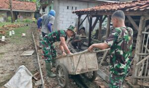 Personel Satgas TMMD Tetep Semangat Melanjutkan Pembangunan 